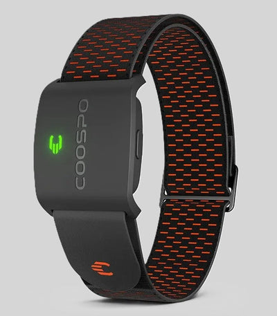 Active Tech fitness tracker with a black strap featuring orange mesh pattern and a green LED logo.
