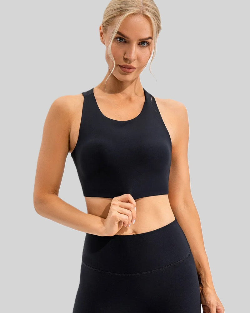 Activewear set: woman in black sports bra and high-waisted leggings.