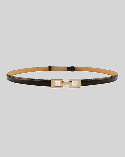 Black leather belt with tan interior and gold-tone geometric buckle.