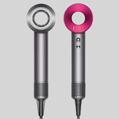Two sleek silver hairdryers with cylindrical bodies; one features a pink ring around the circular nozzle.