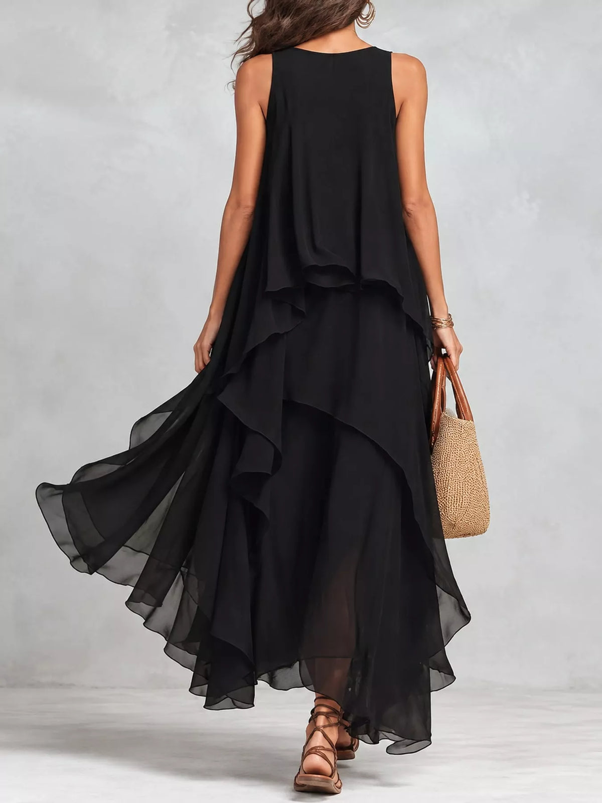 Black sleeveless maxi dress, back view, with layered ruffle skirt