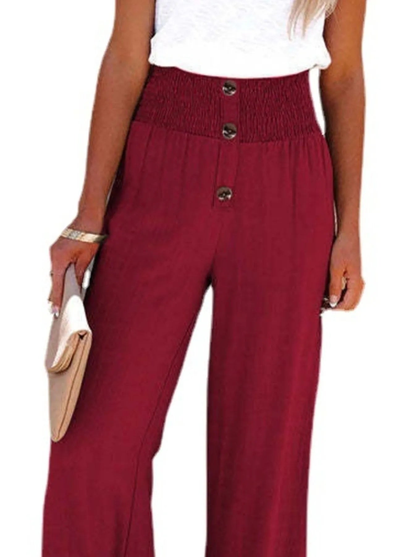 Burgundy high-waisted wide-leg pants with textured fabric and front buttons