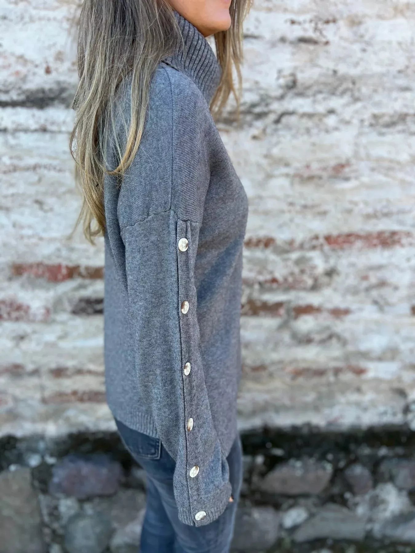 Heather gray long sleeve turtleneck sweater with buttoned cuffs