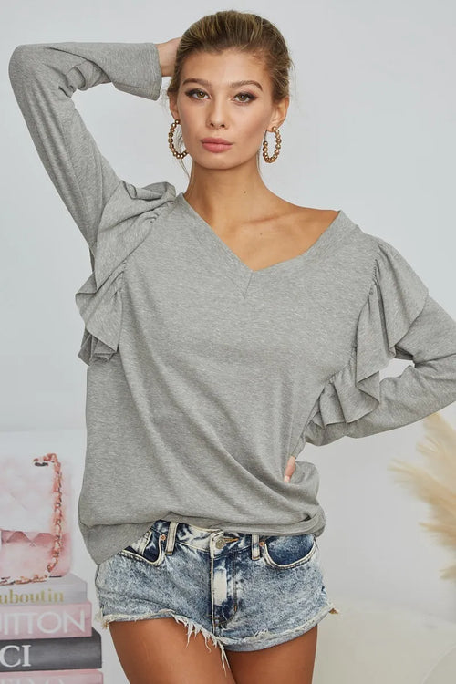 Grey triblend V-neck top with shoulder ruffle detail and long sleeves