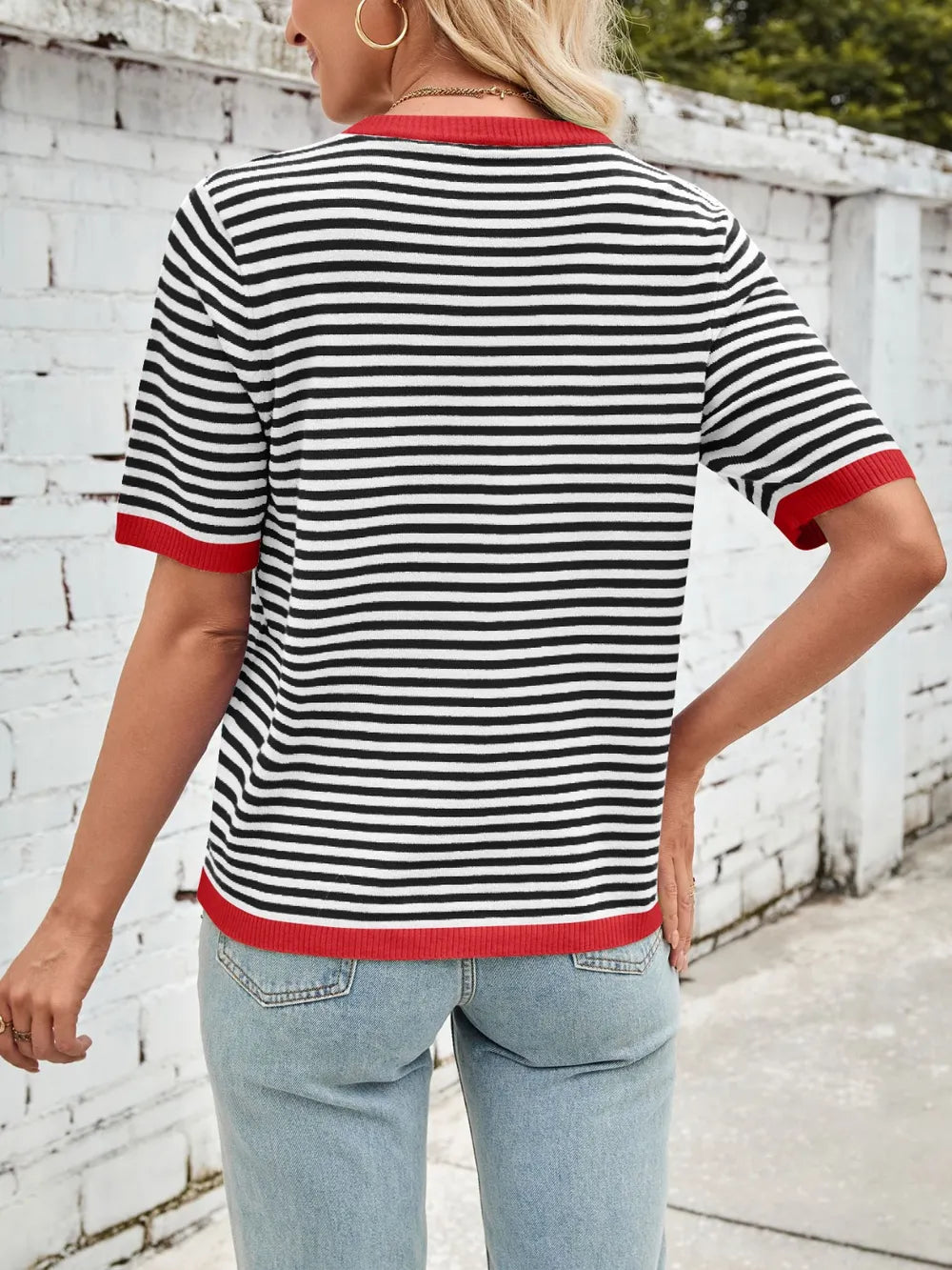Striped knit top, black-and-white horizontal stripes with red ribbed trim at back sleeves