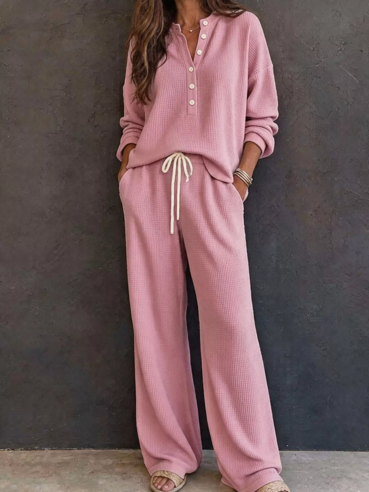 Pink waffle-knit lounge set: button henley pullover and drawstring wide-leg pants.