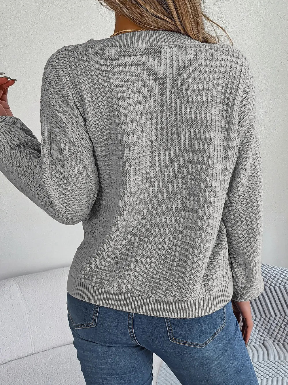 Gray cable-knit round-neck long-sleeve sweater, full back view with ribbed hem and cuffs