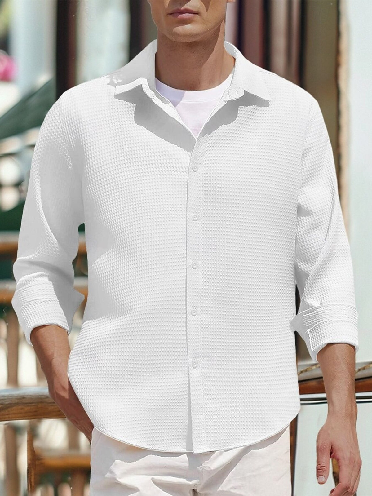 Men's white waffle knit cotton button-front shirt with long sleeves and chest buttons