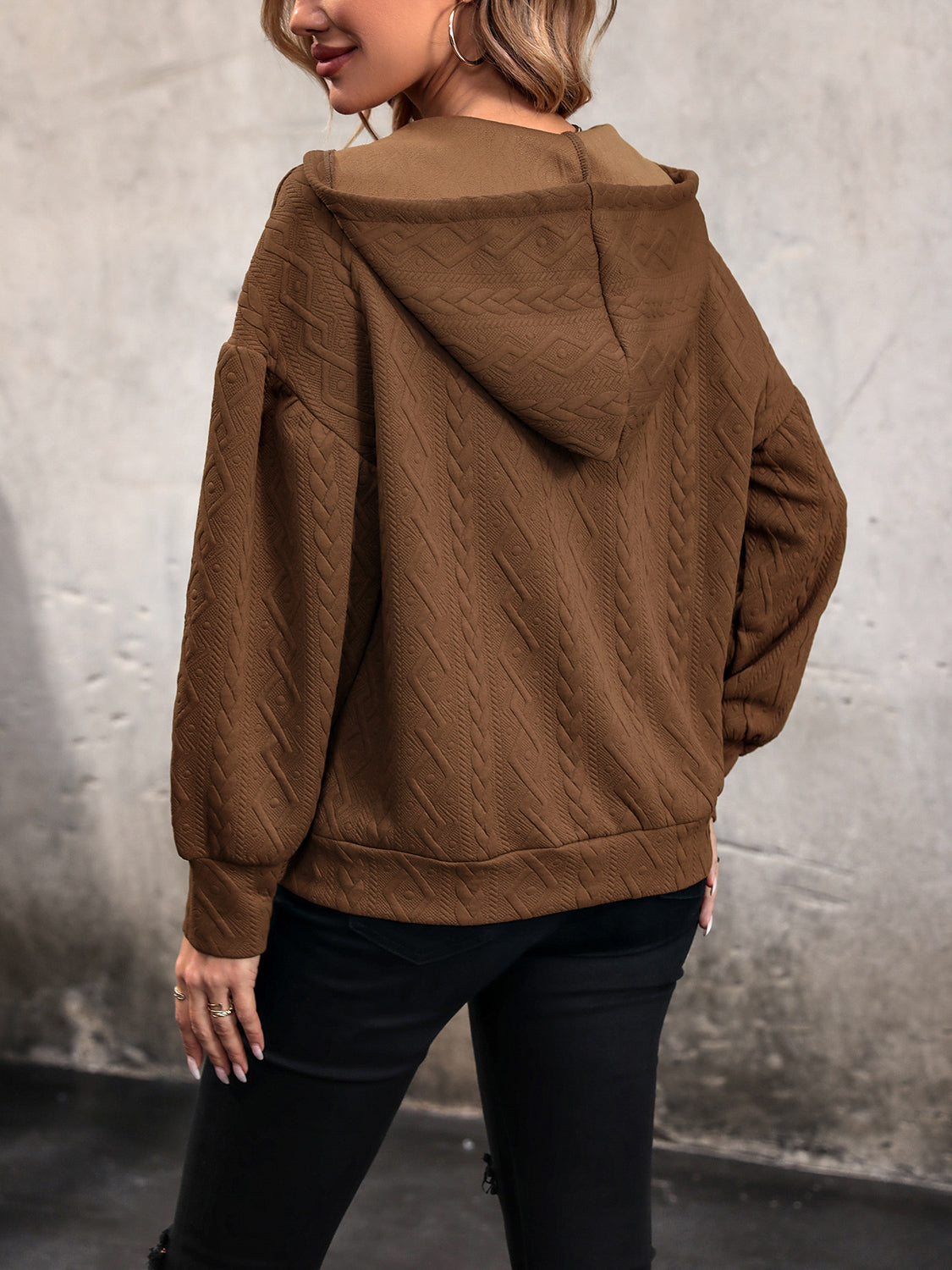 Chestnut brown hoodie with hood, dropped shoulders, long sleeves, textured fabric