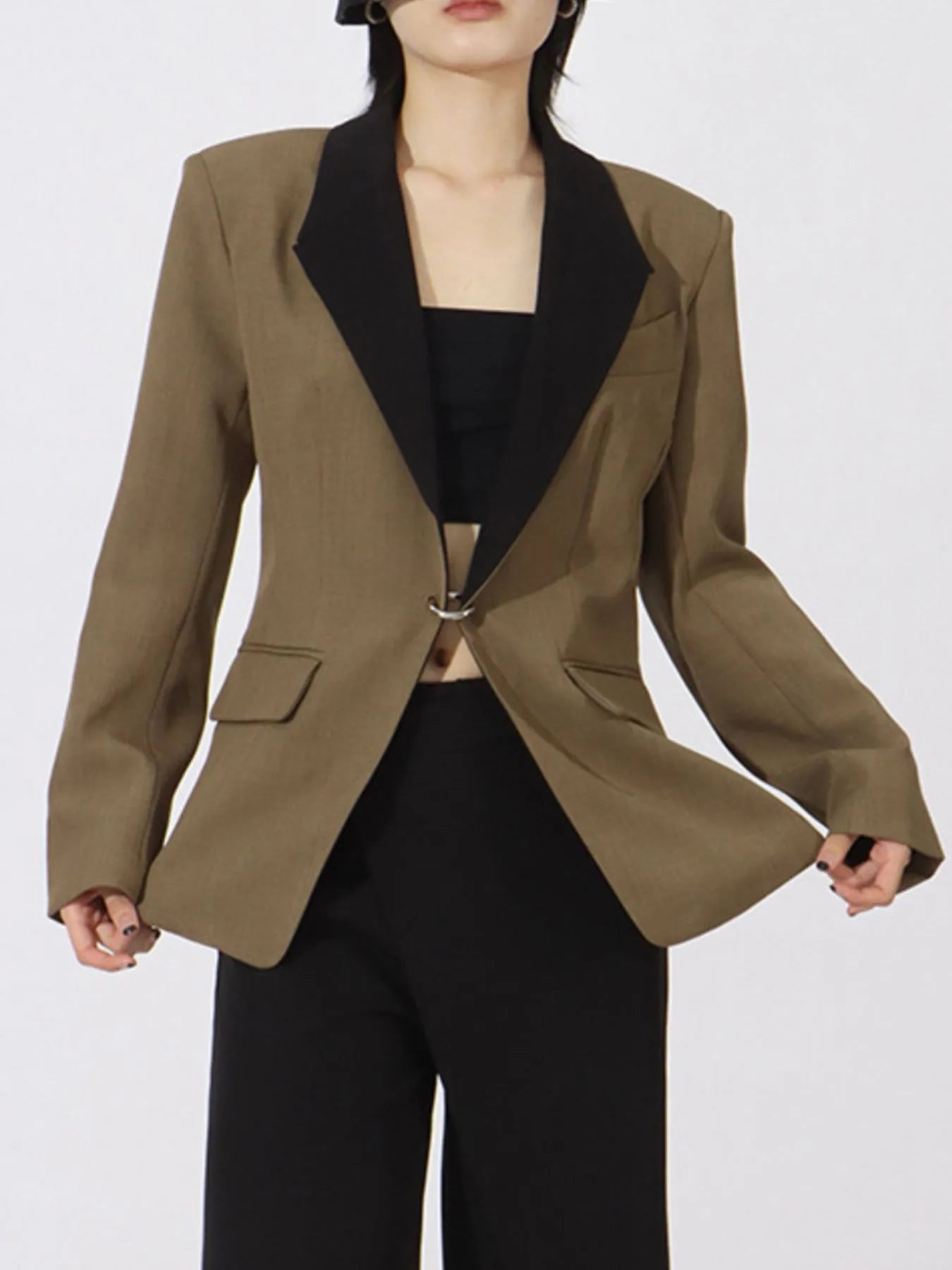 Khaki green blazer with black contrast lapels and two flap pockets, long sleeves