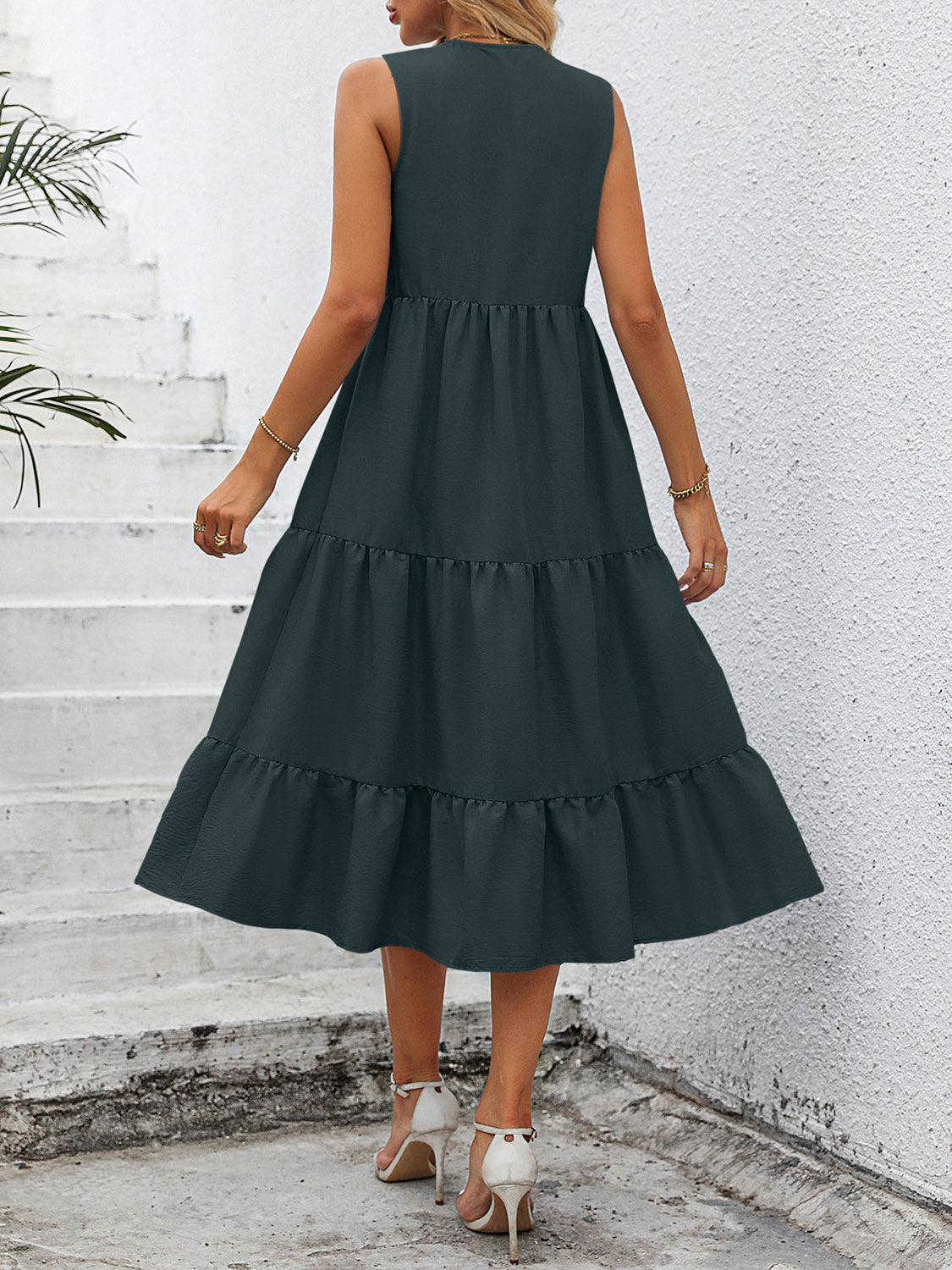 V-neck sleeveless tiered dress, dark green, back view with tiered skirt