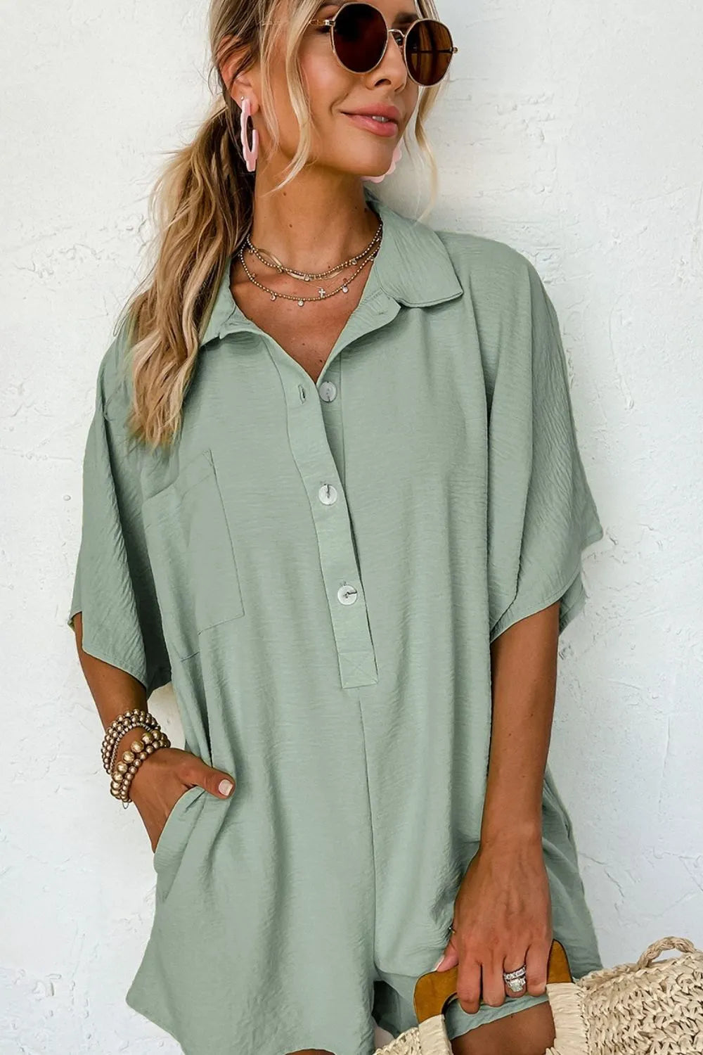 Sage collared button romper with chest pocket and short sleeves