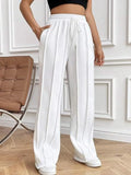 White wide-leg drawstring pants with pockets and elastic waistband