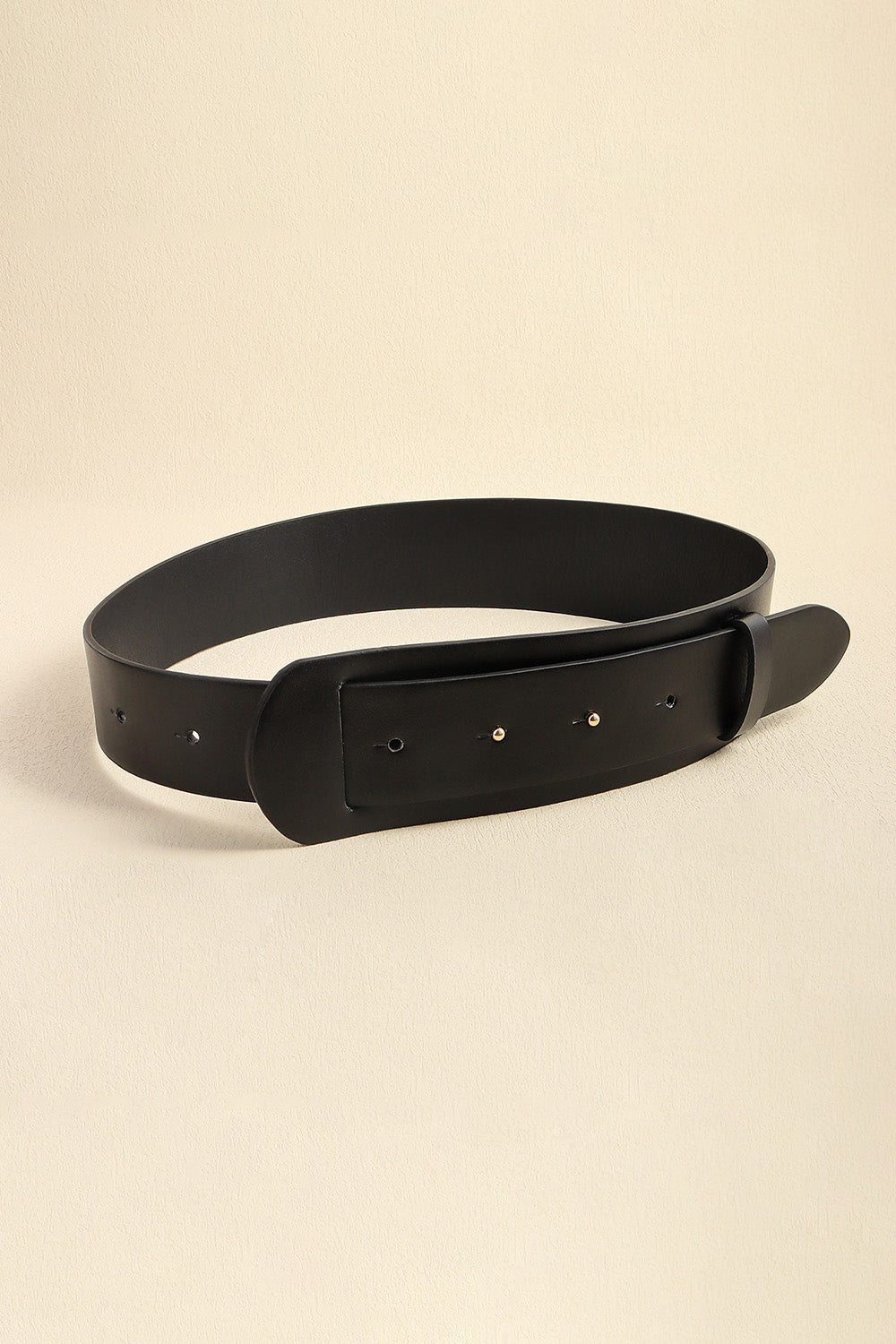 Vegan leather belt in black with rounded buckle end, wide strap and metal pin holes