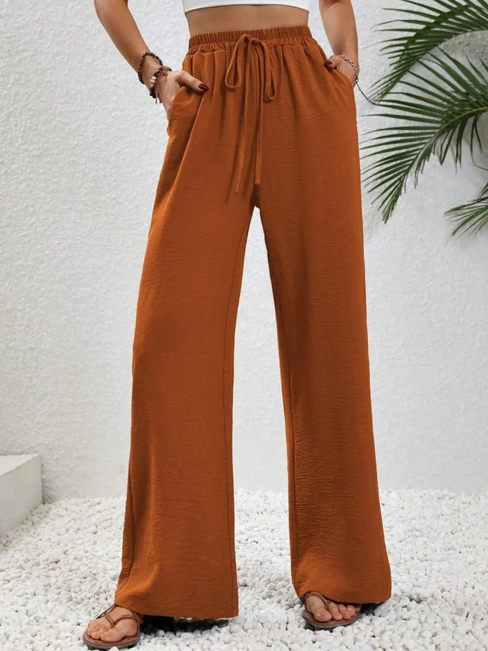 Caramel wide-leg drawstring pants with elastic waist and side pockets