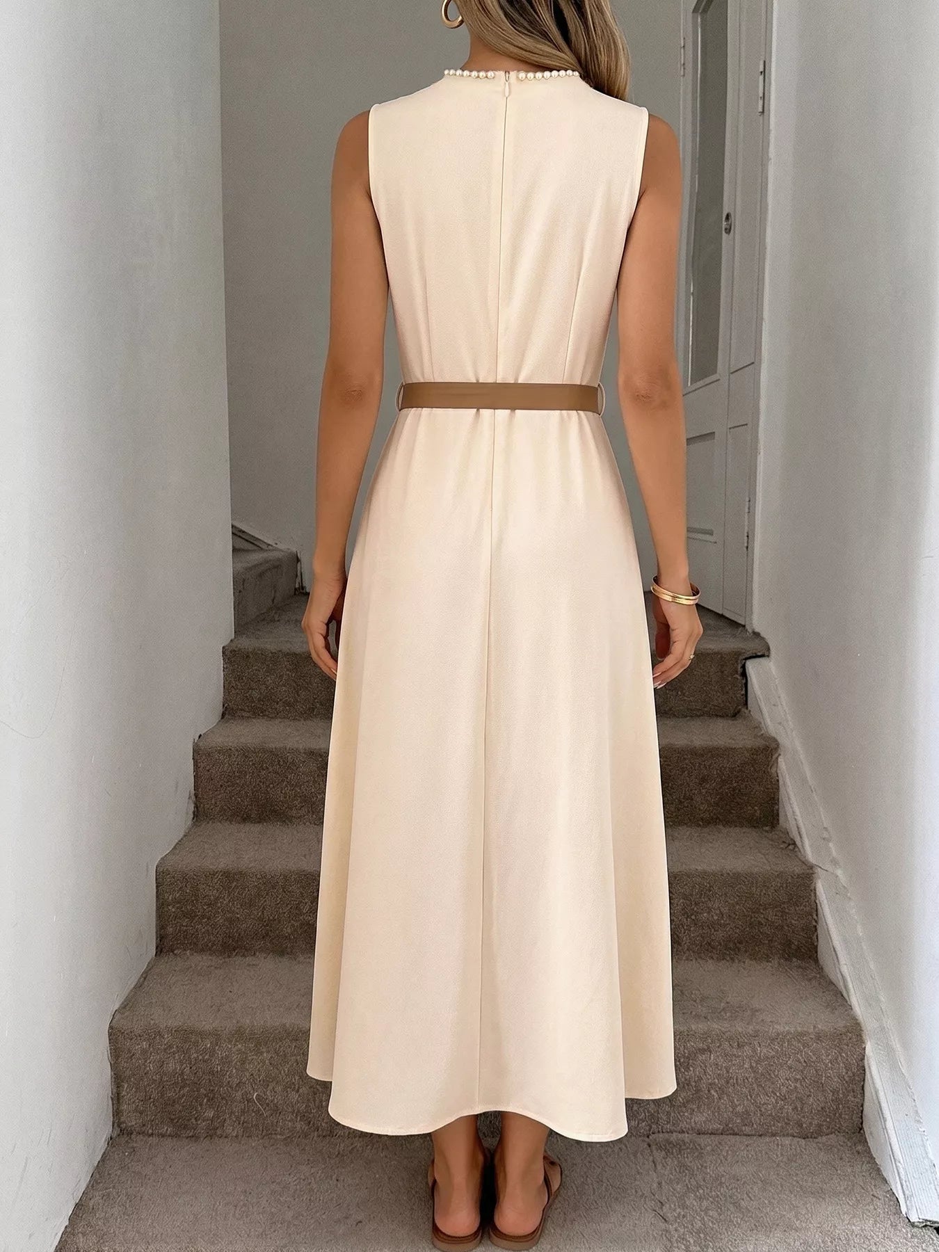 Cedar & Moore Sleeveless A-Line Midi Dress in cream with tan belt, back view