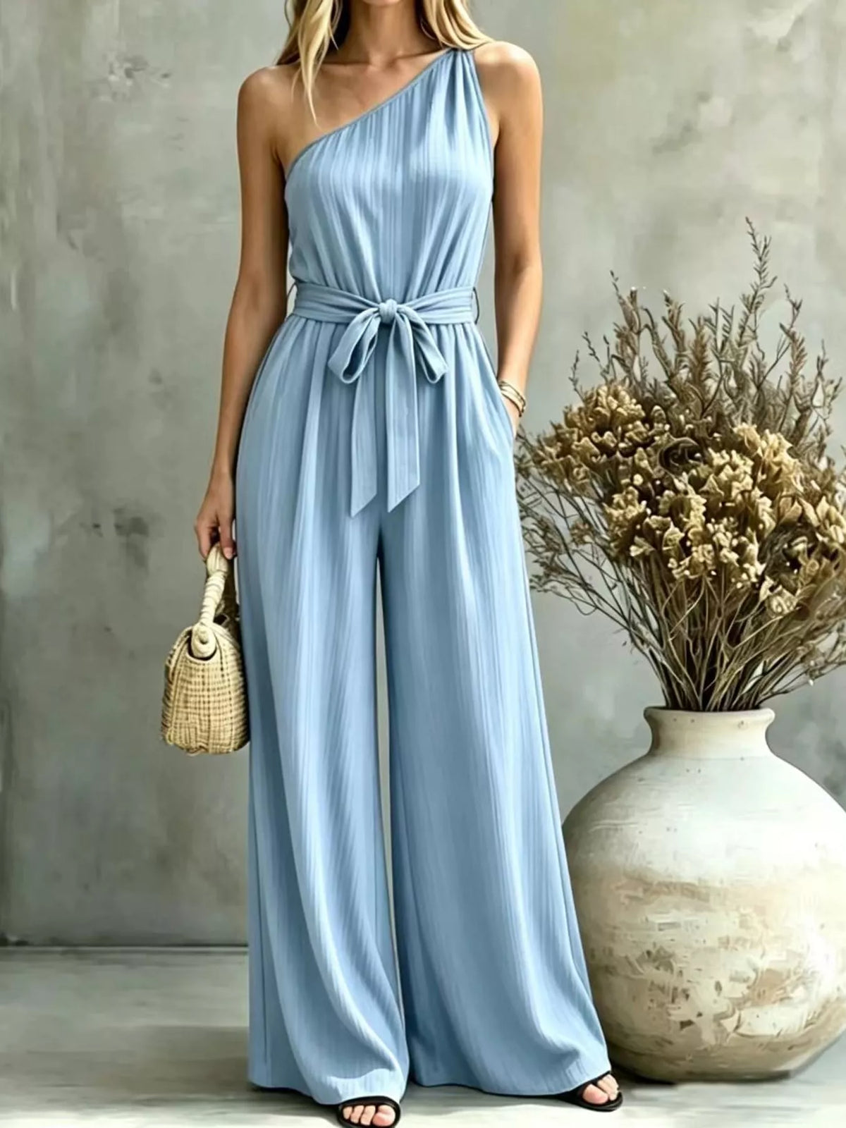 Light blue one-shoulder pleated wide-leg jumpsuit with waist tie belt