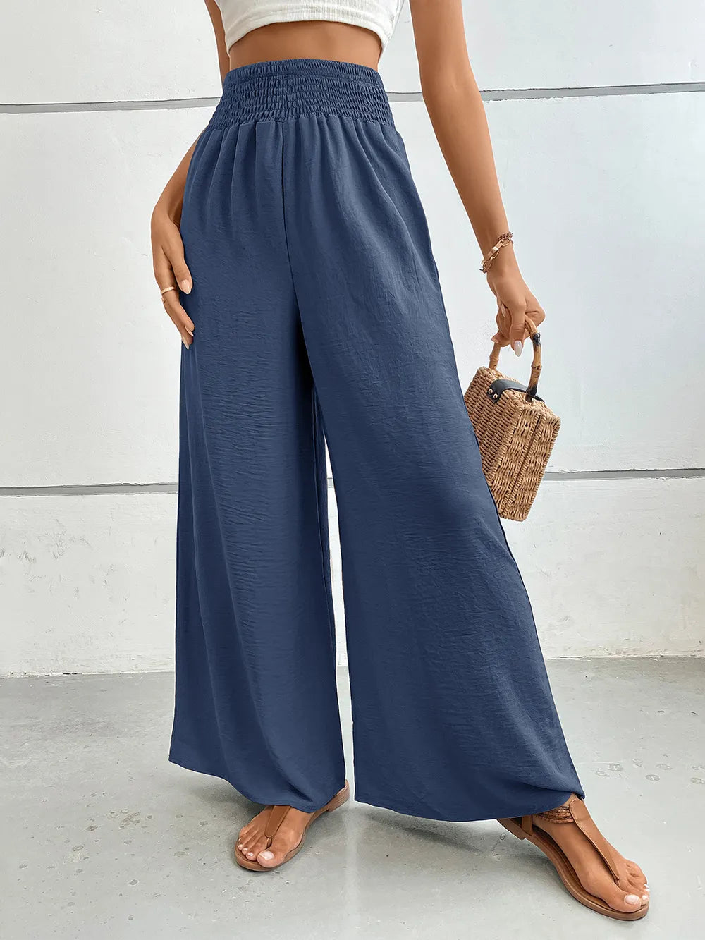 Wide-leg pants in dusty blue with elastic waist, drapey fabric, side pockets