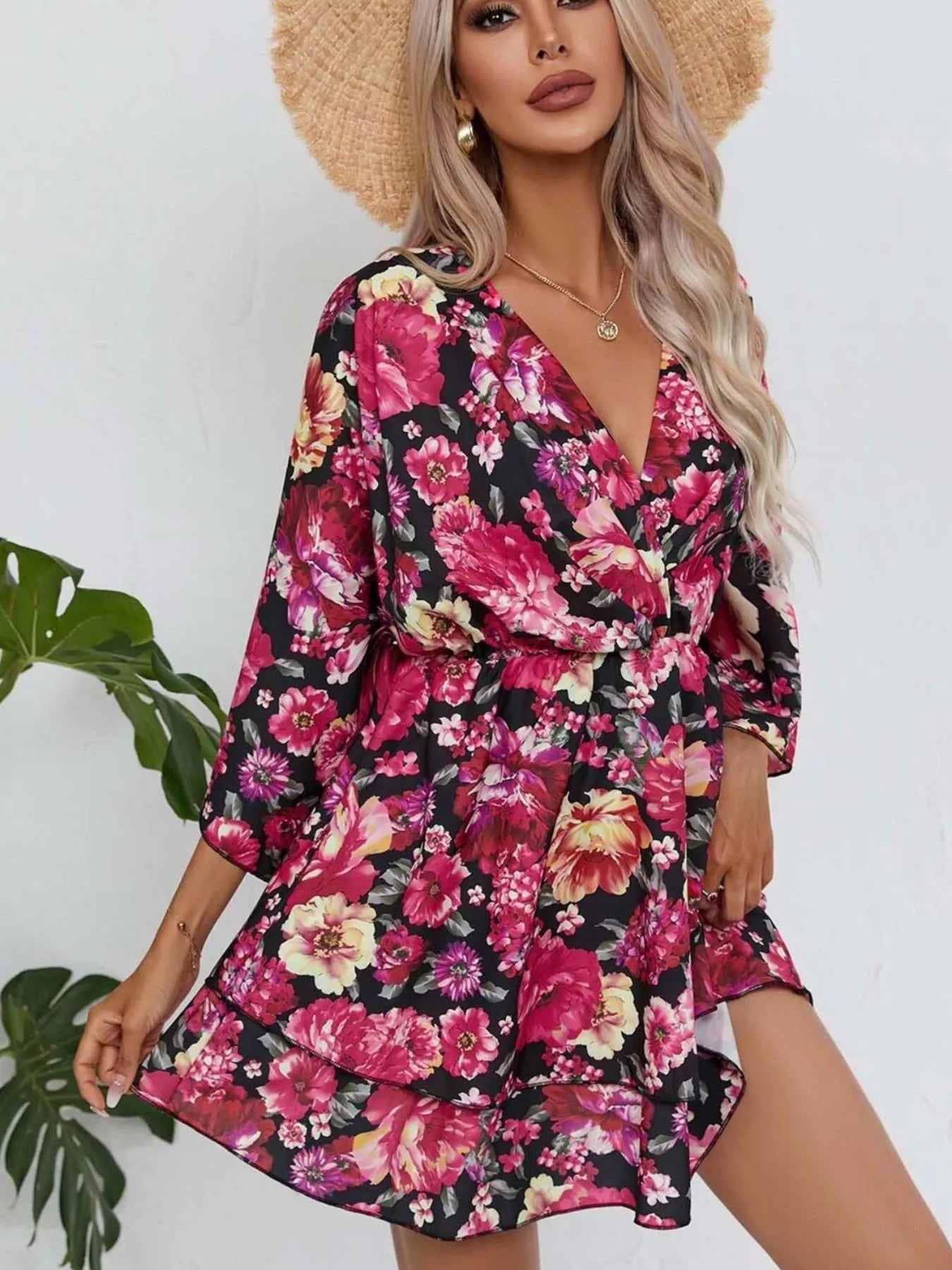 Floral layered mini dress with V-neck and tie waist, long sleeves, black base