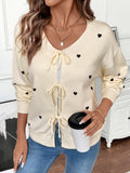 Cream heart tie-front long sleeve cardigan with V-neck bow ties and ribbed cuffs