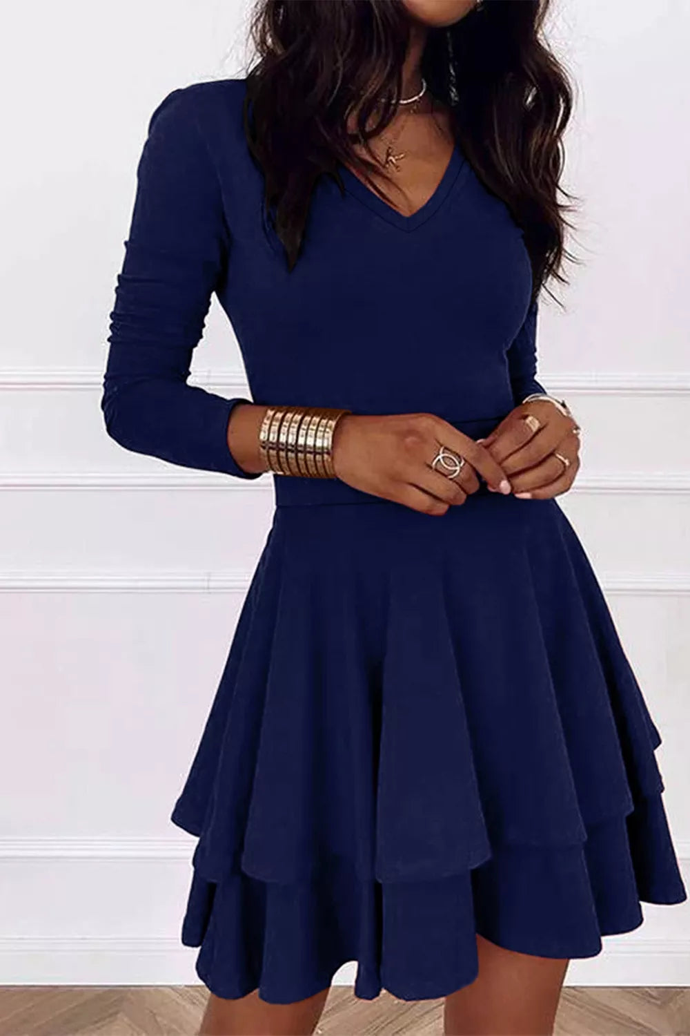 Dark navy layered long-sleeve V-neck mini dress with tiered flared skirt