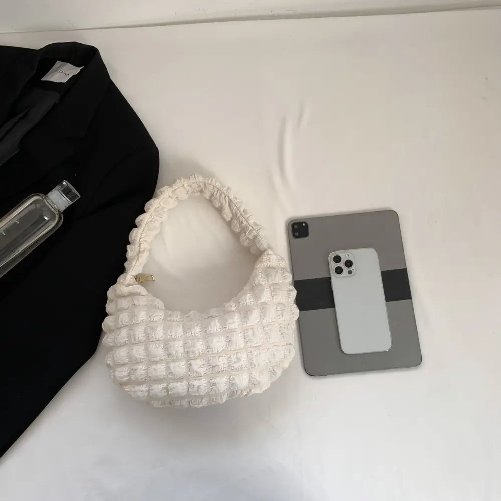 White textured small hobo handbag with open top and braided handle
