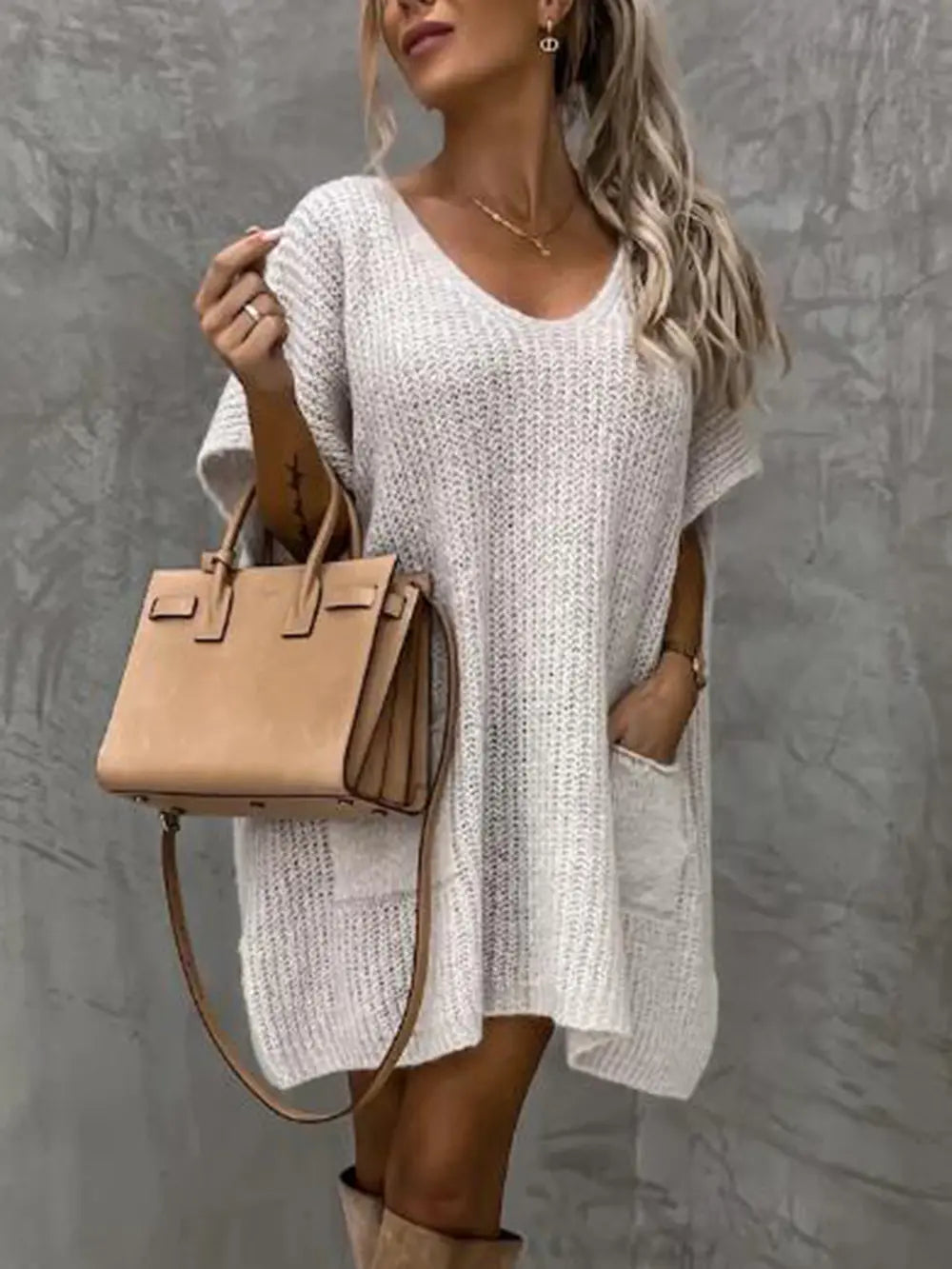 Light white V-neck short-sleeve knit sweater with front pocket, tunic length.
