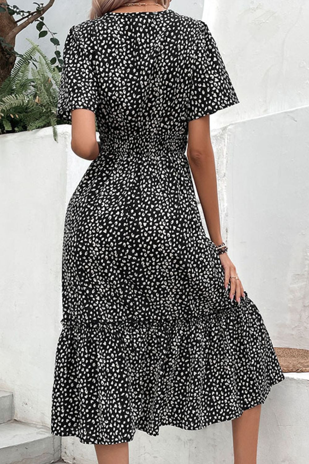 Black leopard print midi dress, short sleeves, V-neck and layered tiered hem