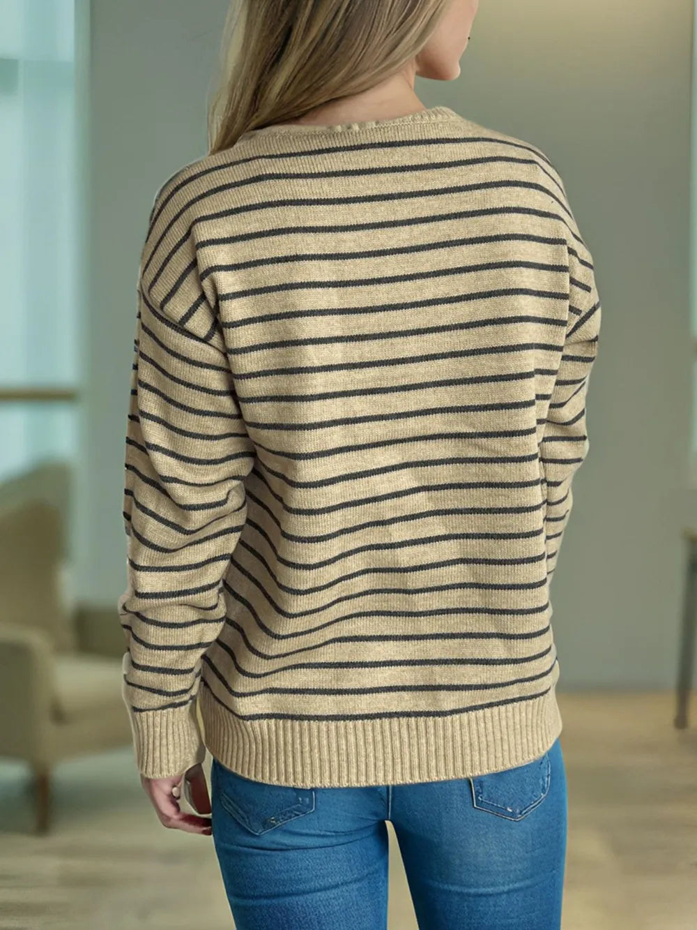 Striped mock neck sweater, tan with dark horizontal stripes and ribbed cuffs