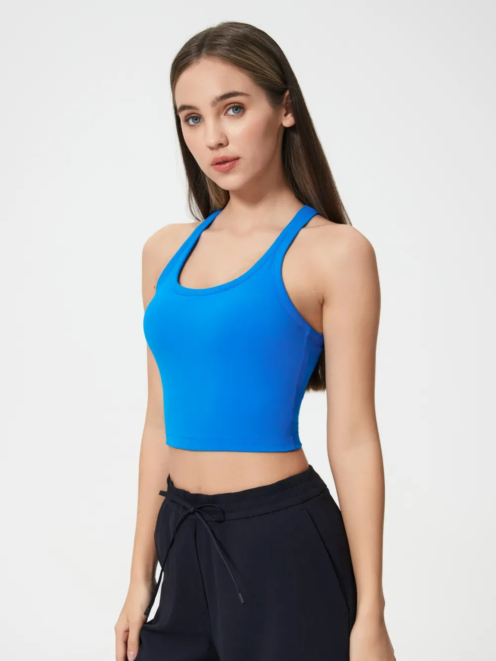Royal blue scoop neck active tank with racerback, sleeveless cropped style.