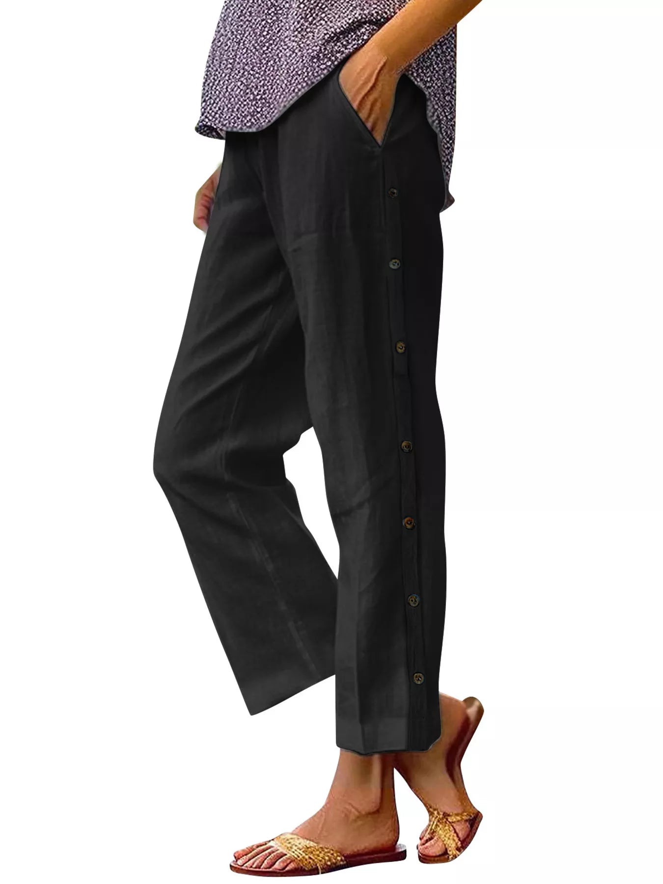 Black polyester pants with side buttons and side pockets, relaxed fit