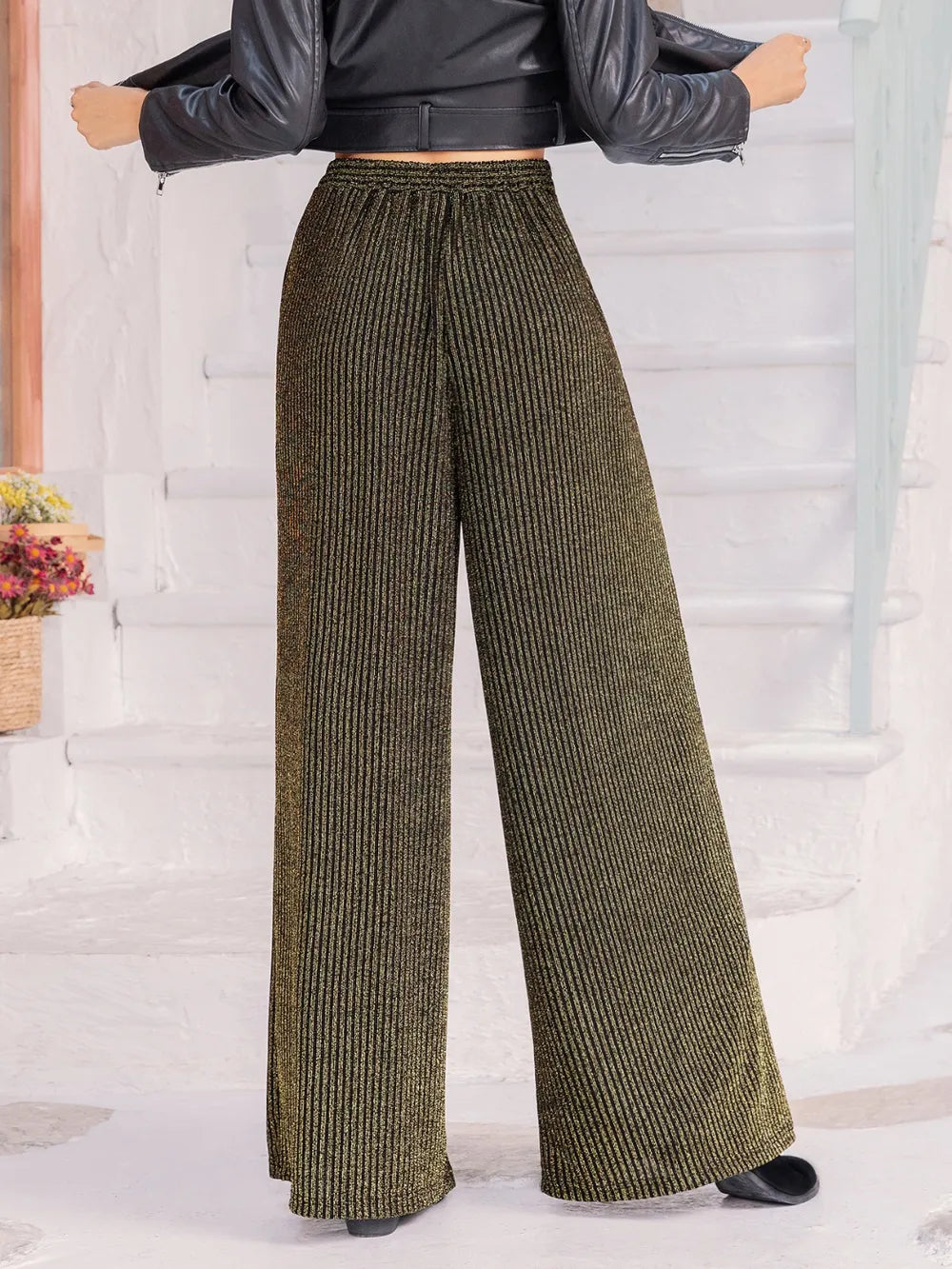Dark green wide-leg pants with ribbed texture and tied elastic waist
