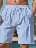 Men's lightweight drawstring shorts, light blue, elastic waistband and visible drawcord
