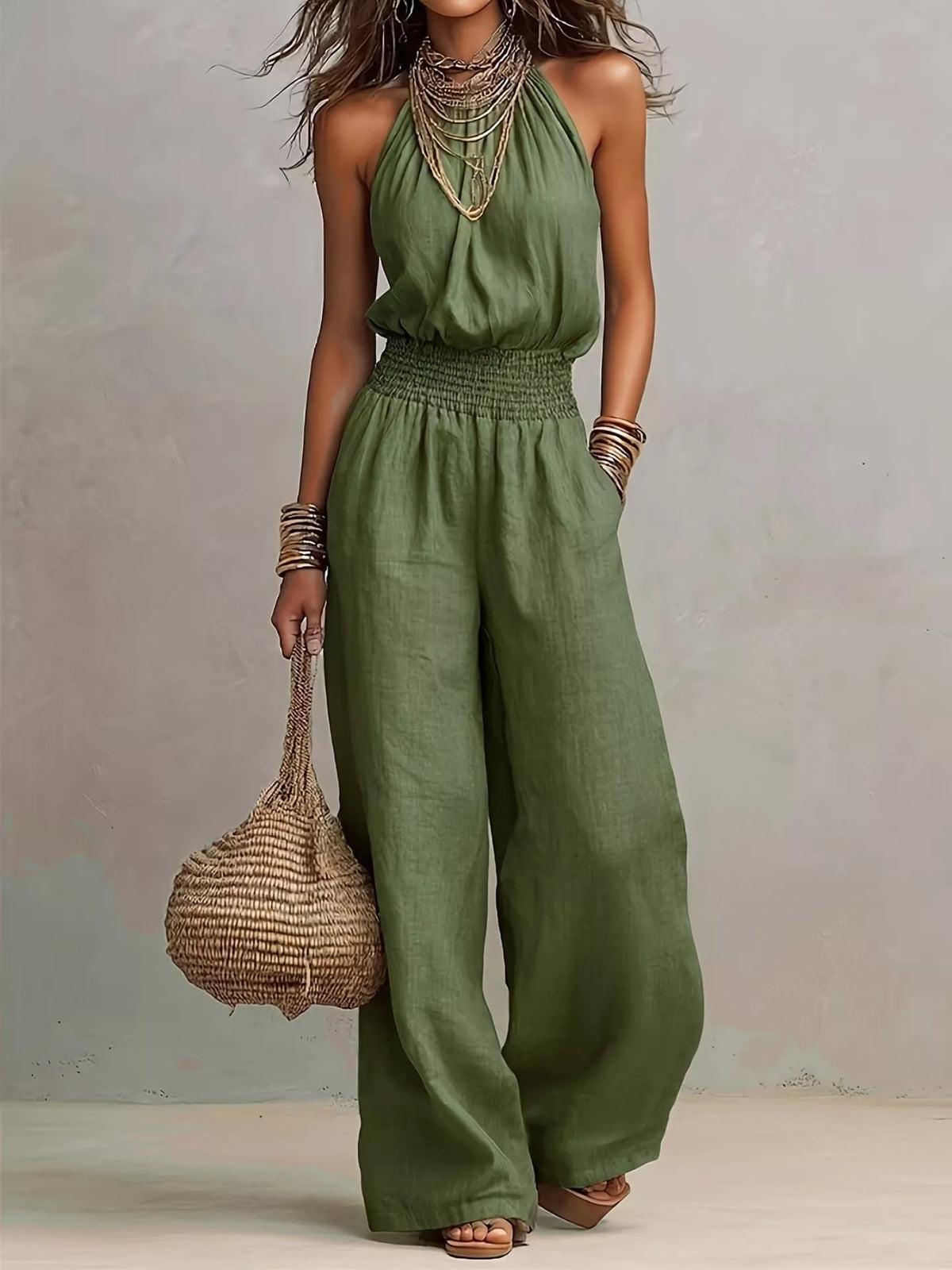 Pocketed halter neck wide-leg jumpsuit in green, sleeveless halter with smocked waist