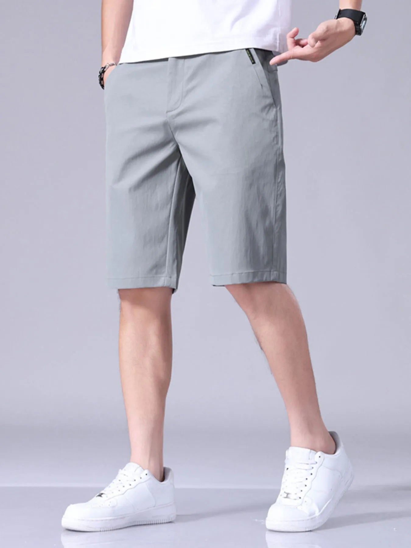 Light gray men's casual shorts with pockets and belt loops, relaxed fit