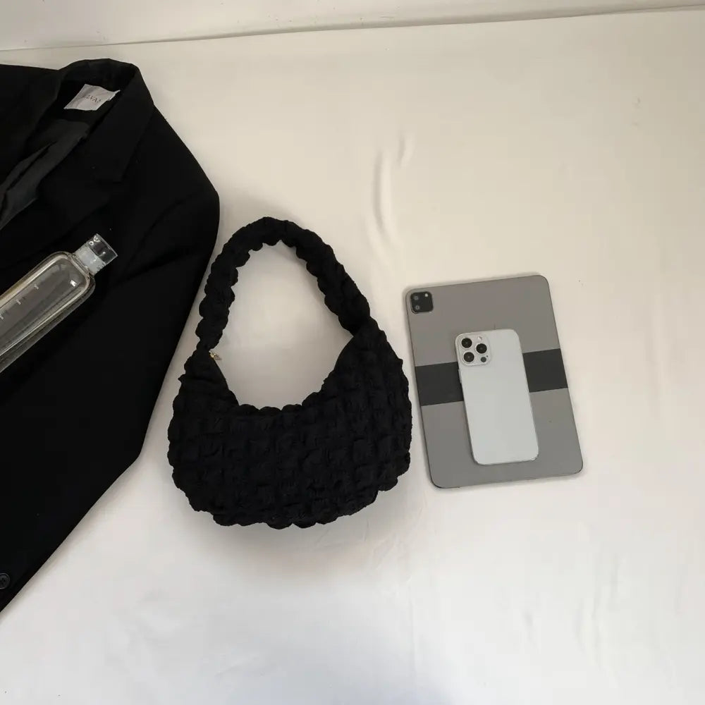 Black small textured handbag with braided strap handles