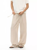 Khaki wide-leg drawstring pants with relaxed fit and side pockets