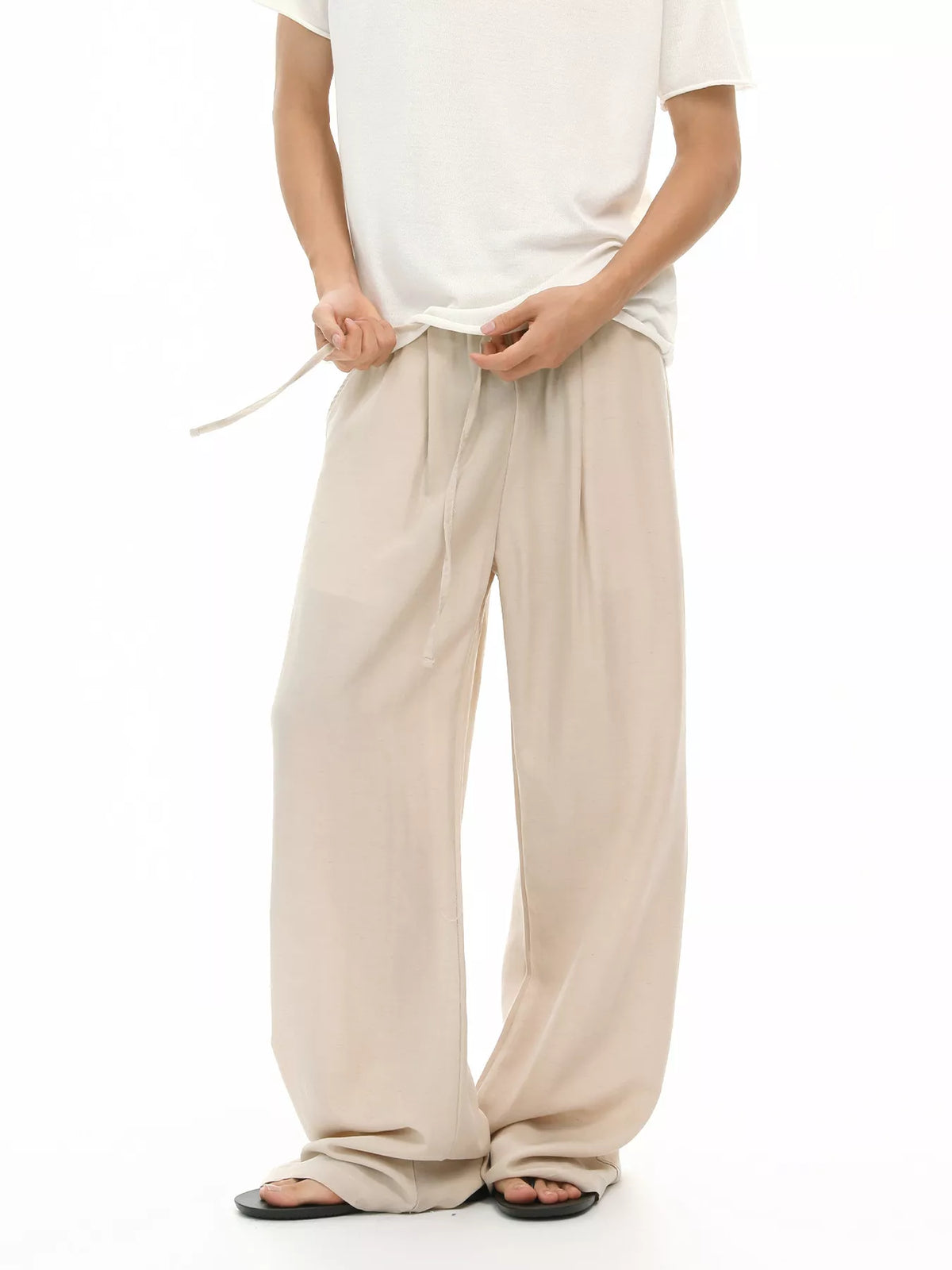 Khaki wide-leg drawstring pants with relaxed fit and side pockets