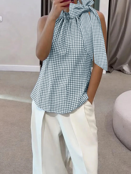 Sleeveless gingham blouse top with tied bow at shoulder and high ruffled neck