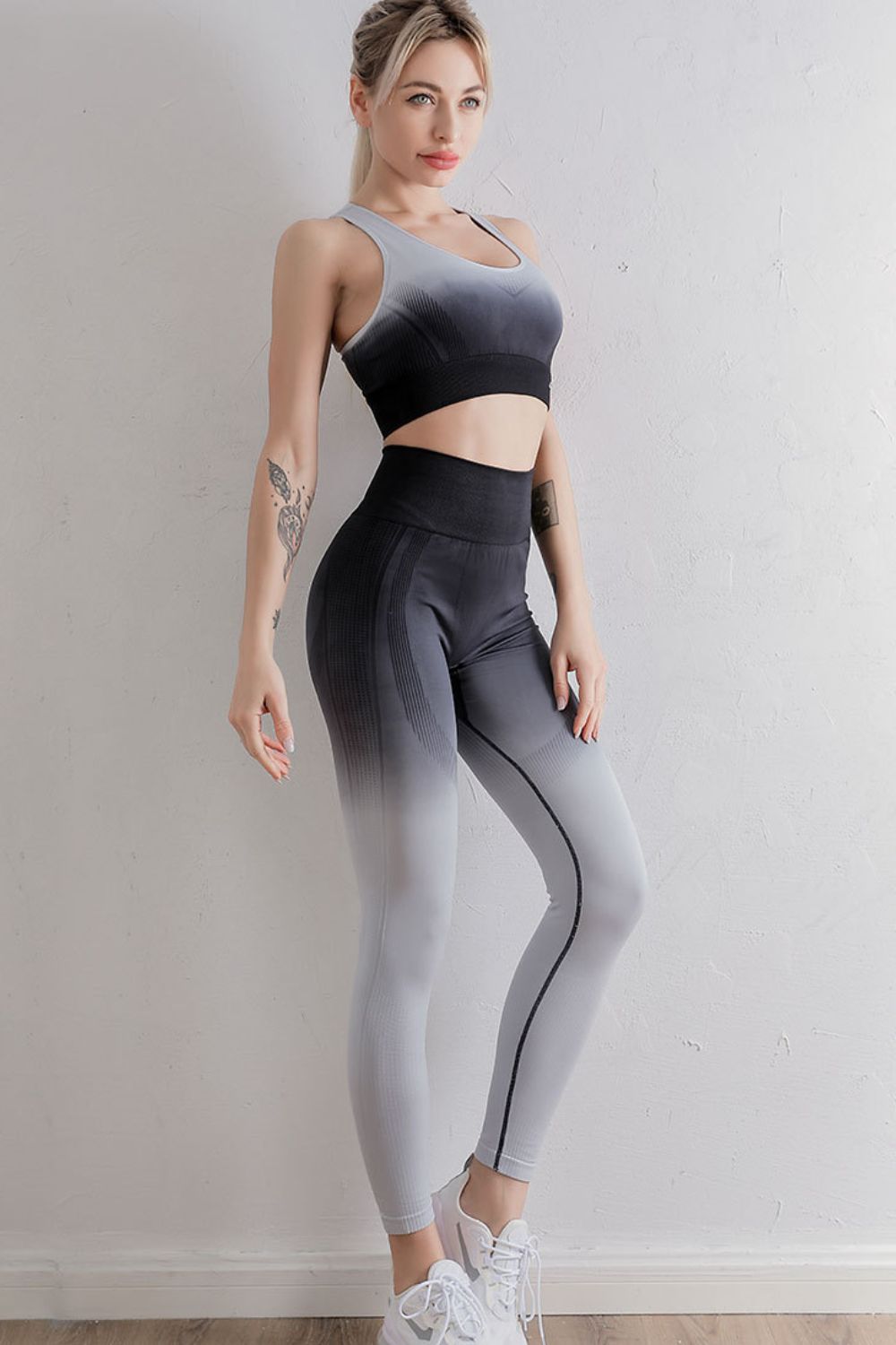 Sports bra and leggings set with grey-to-black gradient, seamless racerback style