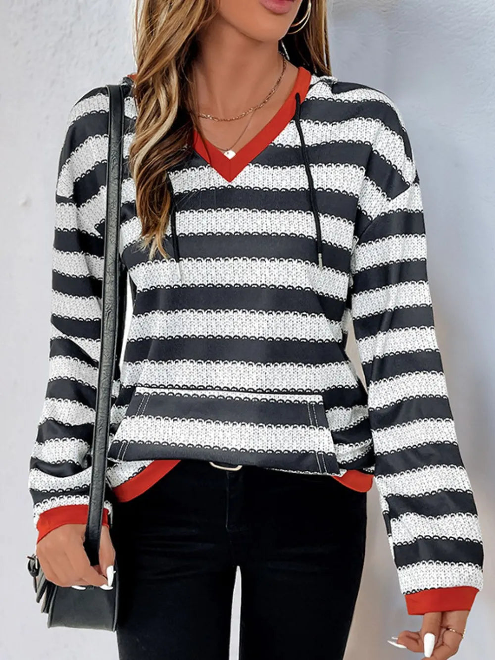 Contrast striped long sleeve hoodie with red V-neck trim and black-and-white stripes