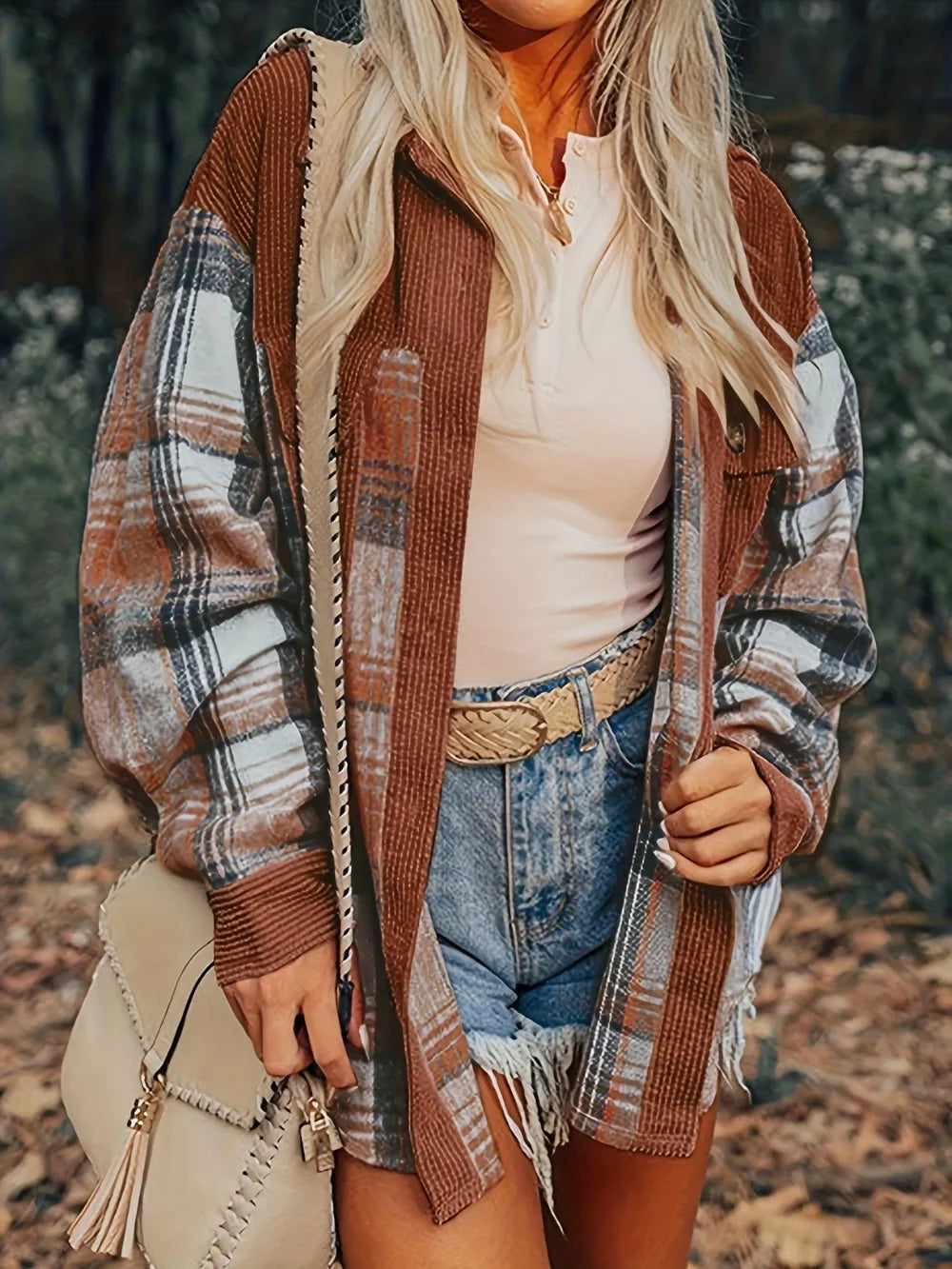 Brown plaid button-up shacket with collared neck, long sleeves, front pockets