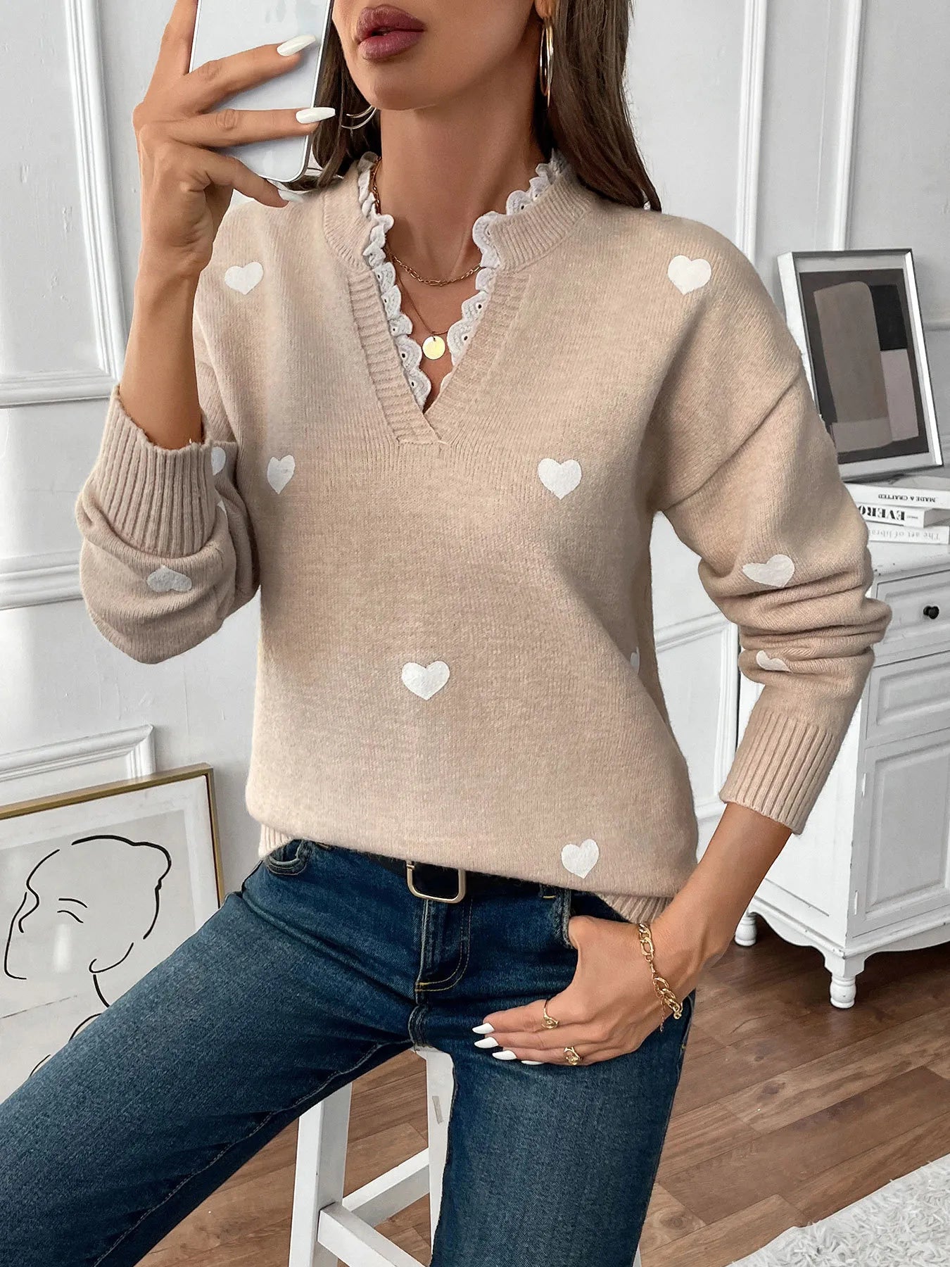 Light khaki v-neck long sleeve sweater with white heart motifs and lace-trim neckline