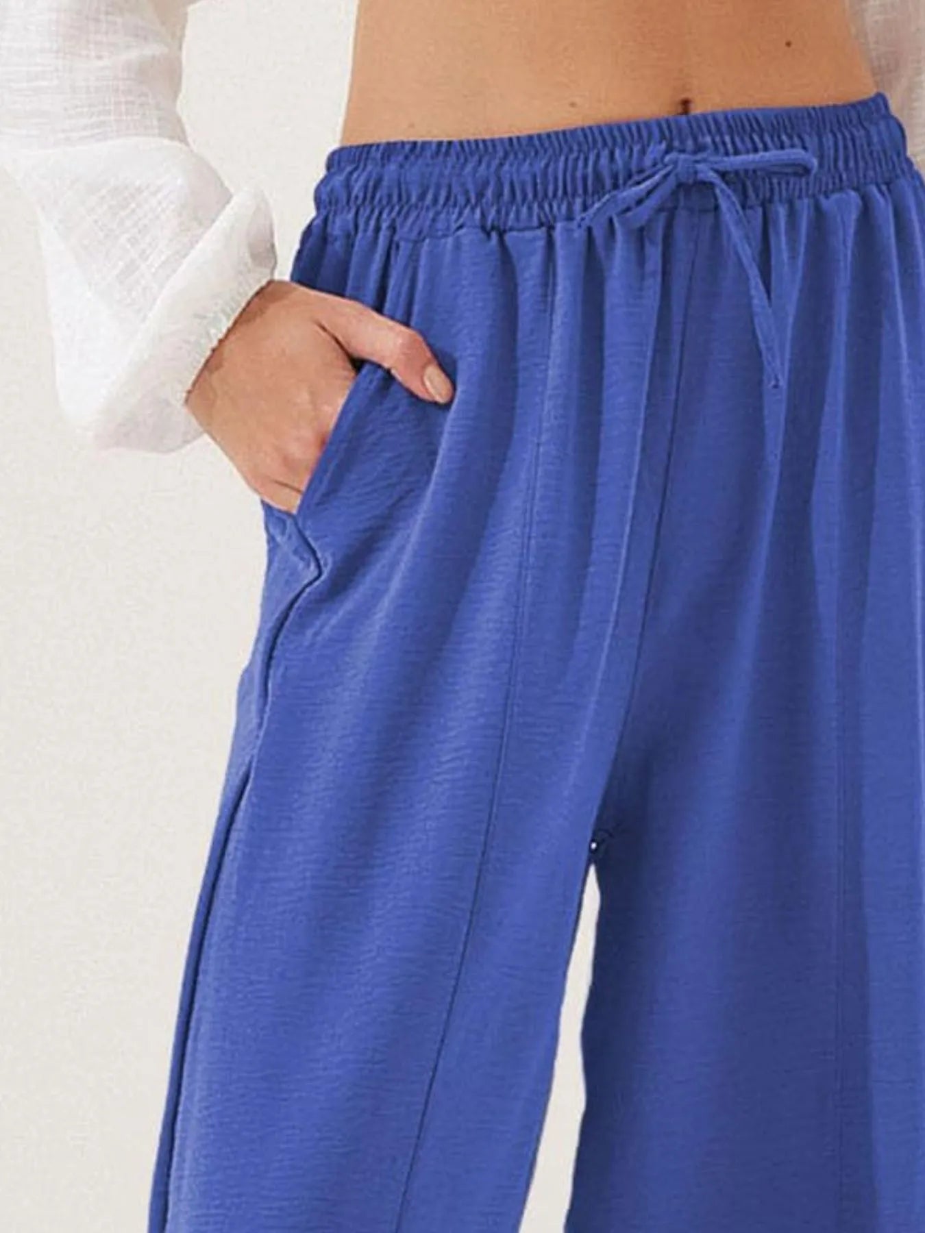 Royal blue drawstring wide-leg cropped pants with elastic waist and tied front