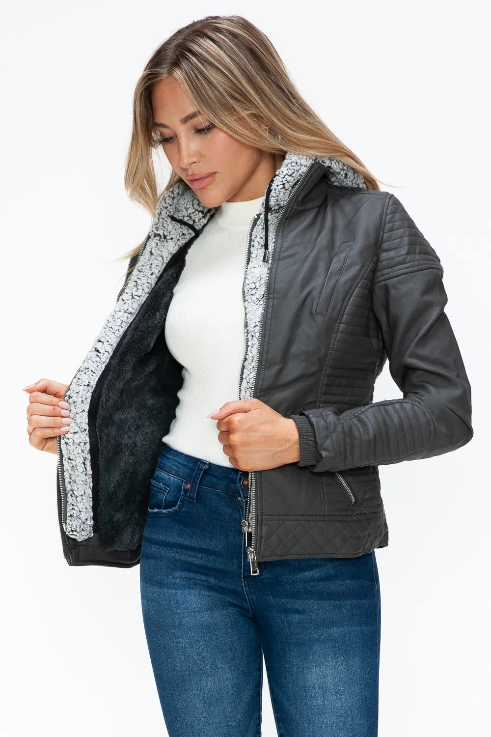 Charcoal zip jacket with fuzzy hood lining, open front detail over light top.