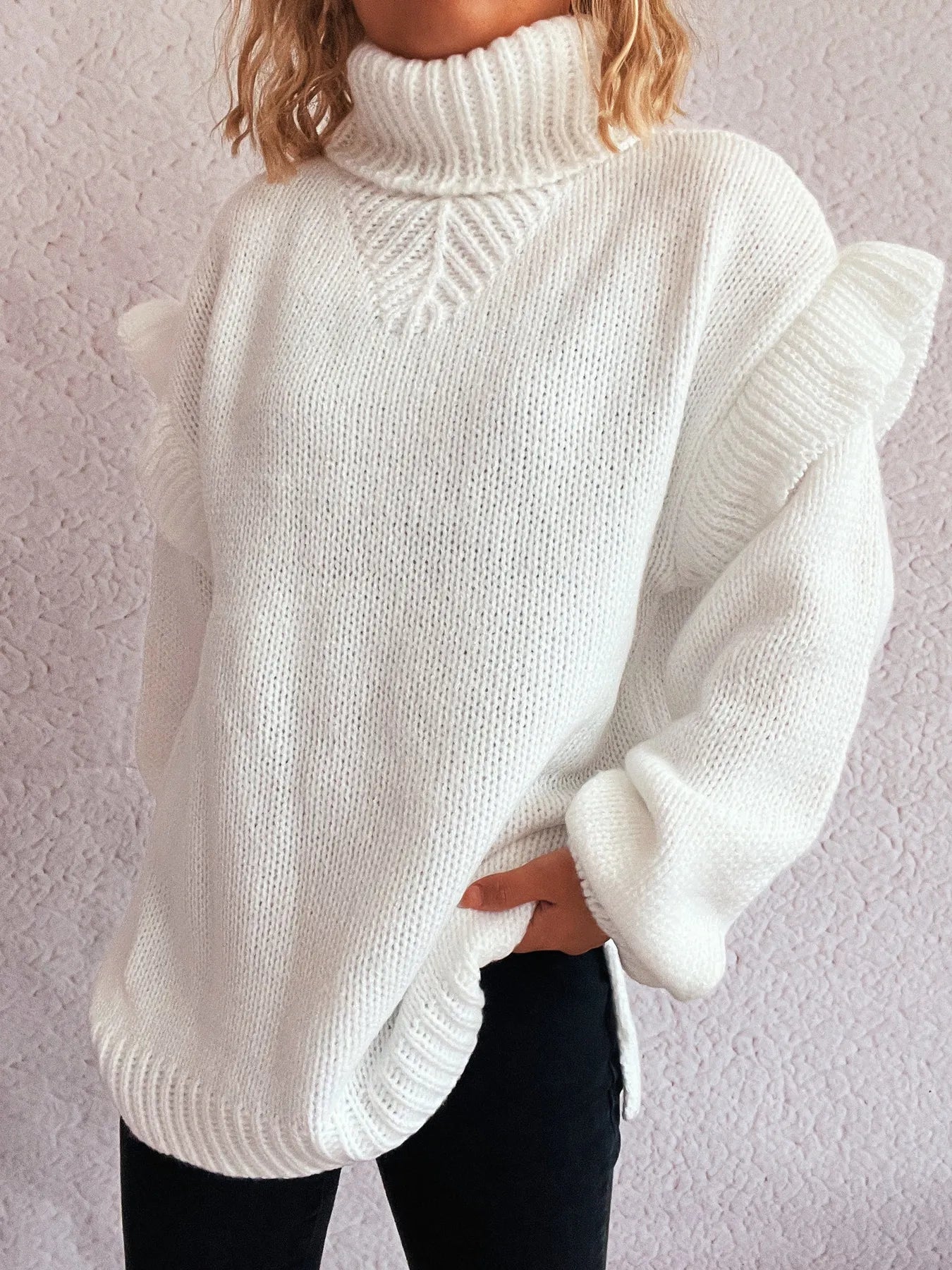 White ruffled turtleneck long-sleeve sweater with textured knit pattern