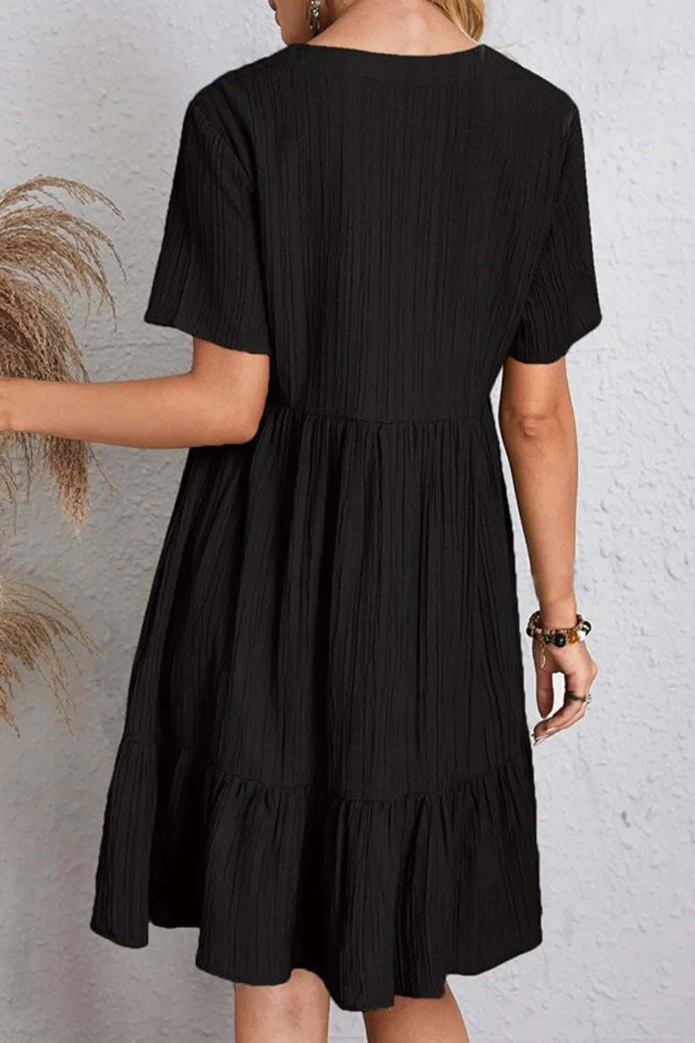 Black short-sleeve ruched waist dress with tiered skirt