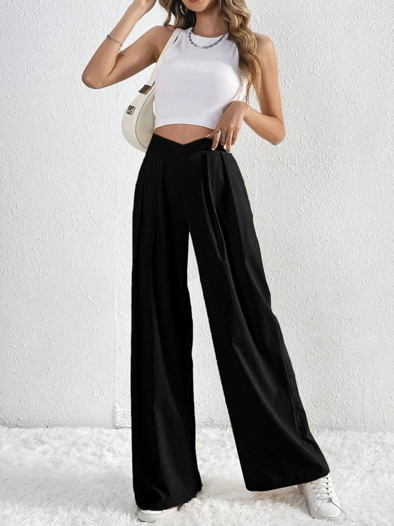 Black wide-leg pants with ruched front and V-waist detail