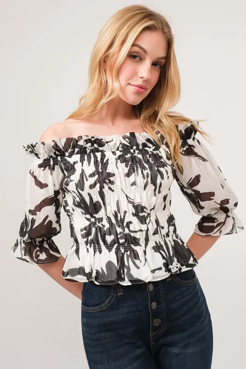 Smocked off-shoulder floral top, cream with black print, ruffled sleeves