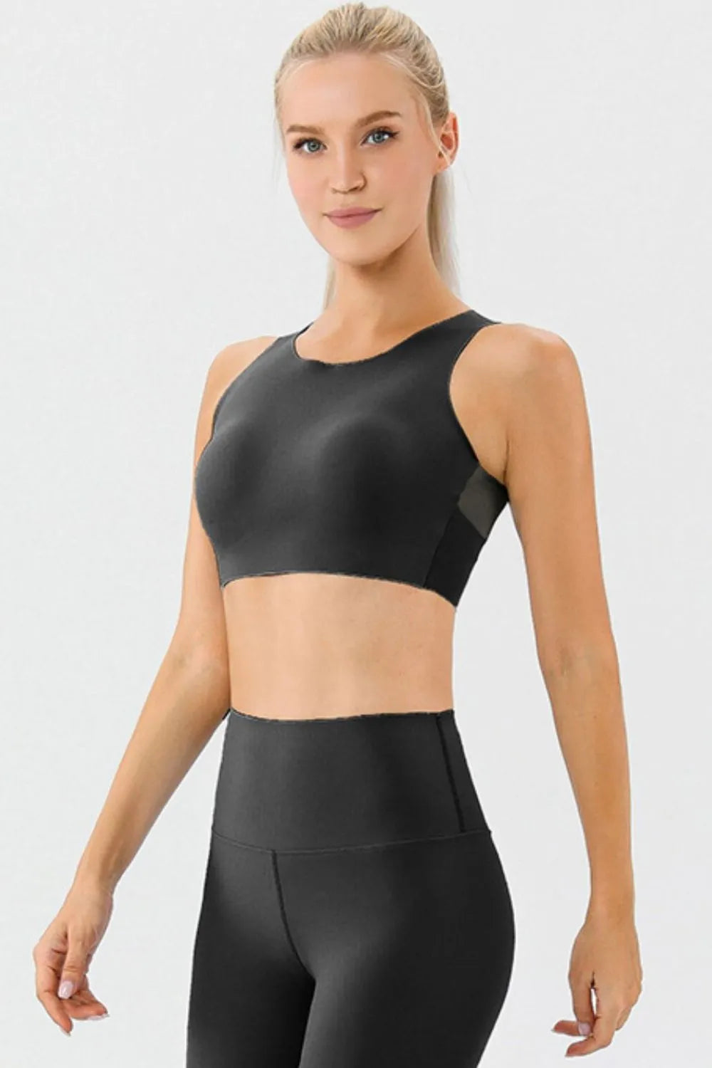 Black round-neck active bra with wide straps, front view